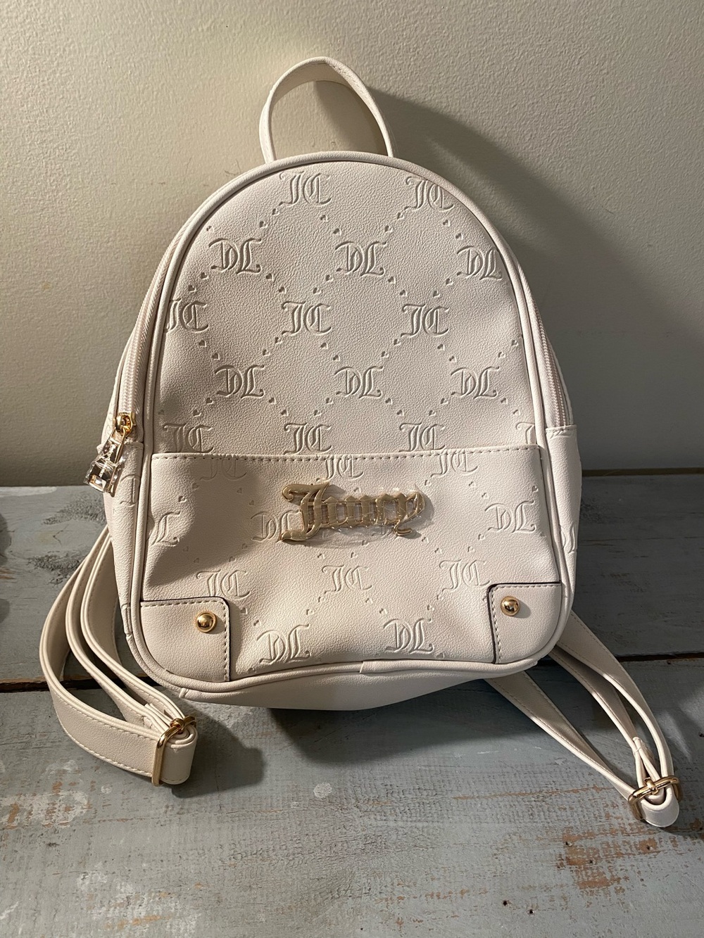 NWOT Juicy Couture Cream Embossed Monogram Mini Backpack Gold Hardware